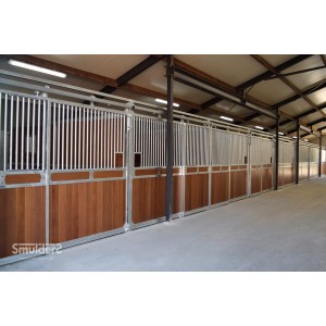 timber and steel stable panels with sliding gates and cement floor
