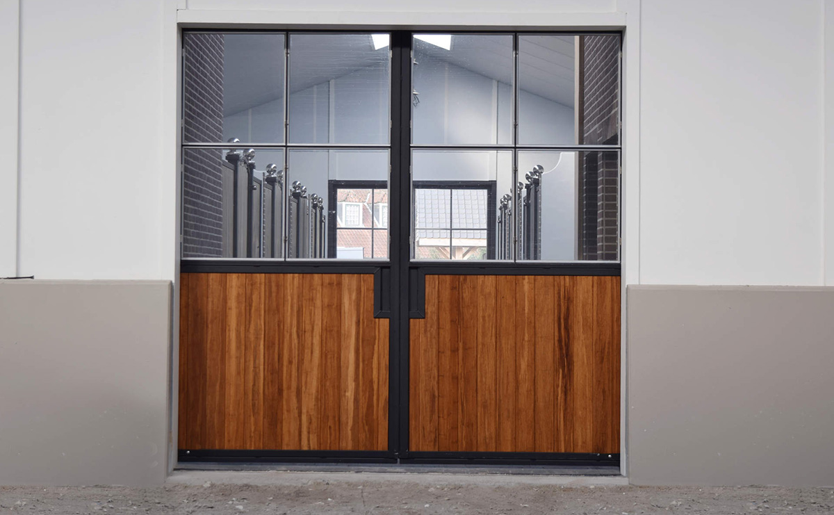 image showing large timber barn doors with metal framing and glass windows