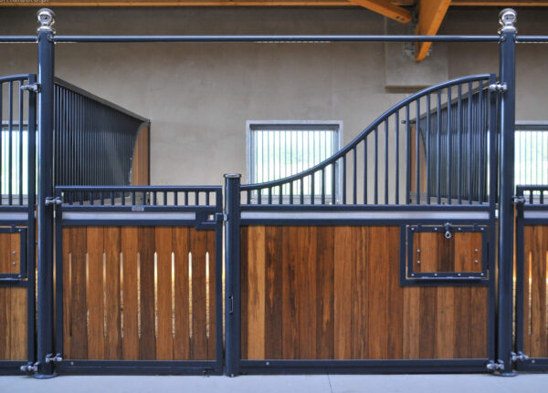 lowline curved steel and timber stable panels with window on back wall