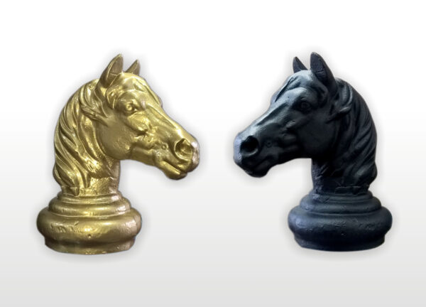 gold and black metal horse head finnials